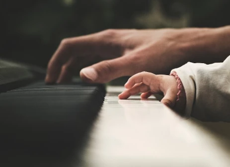 adult & child hand on keyboard