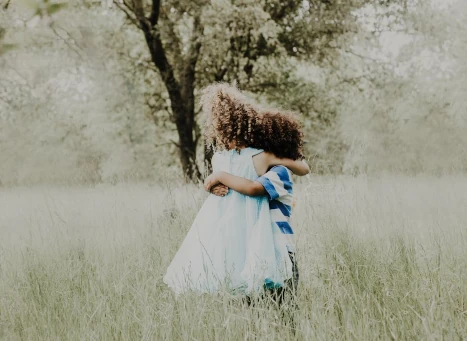 two kids hugging